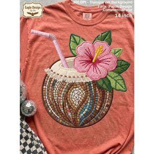 May include: Coral-coloured t-shirt with an embroidered design of a tropical cocktail in a coconut shell. The design includes a pink hibiscus flower, green leaves, and a straw. The text "300 DPI - Transparent Background Faux Patch Design Commercial use 35.56 cm" is visible.
