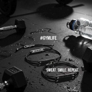 May include: Black and white image featuring fitness accessories. Three black bracelets with silver accents and motivational phrases like "KISS MY REPS" and "SWEAT. SMILE. REPEAT." are displayed. The hashtag #GYMLIFE is visible.