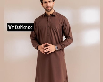 May include: A brown salwar kameez outfit. The long-sleeved top has a button-down collar and a straight hem. The loose-fitting pants are gathered at the ankles. The text "Wm fashion co" is in the upper left corner.