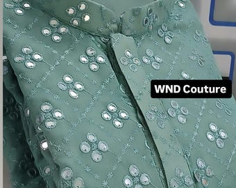 May include: A seafoam green kurta shirt with intricate floral embroidery and mirror embellishments. The shirt features a mandarin collar and a button-down front. The text "WND Couture" is visible on the image.