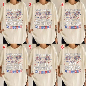 May include: Six cream-colored t-shirts with different text and graphics related to the 4th of July. The shirts have the phrases "Fireworks Director", "Booze and Light the Fuse", "Fly on the 4th of July", "Red, White, and Cute", "Little Firecracker", and "Girl Master".