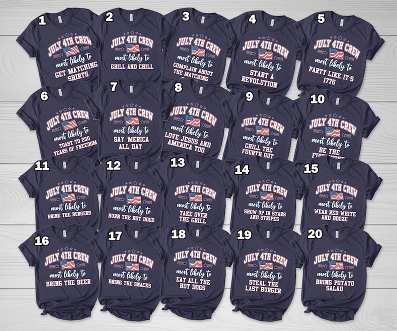 May include: A selection of navy blue t-shirts featuring white text and an American flag design. The shirts have phrases related to the 4th of July, such as "Grill and Chill" and "Bring the Burgers". The shirts are for a summer holiday.