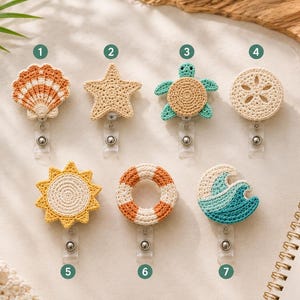 May include: Seven crochet badge reels featuring beach-themed designs: a seashell, starfish, sea turtle, sand dollar, sun, life preserver, and ocean wave. Each item is numbered one through seven and includes a clear plastic strap and metal clip.