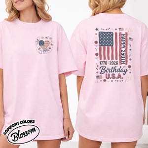 May include: A white ceramic mug with a black handle and the text "But First, Coffee" in a black, handwritten-style font. The mug is on a white surface.