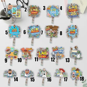 May include: A collection of eighteen colorful badge reels with various designs and the text "LAB STORY". The designs include cartoon characters, stamps, and other playful graphics. Each reel has a retractable cord and a clip.