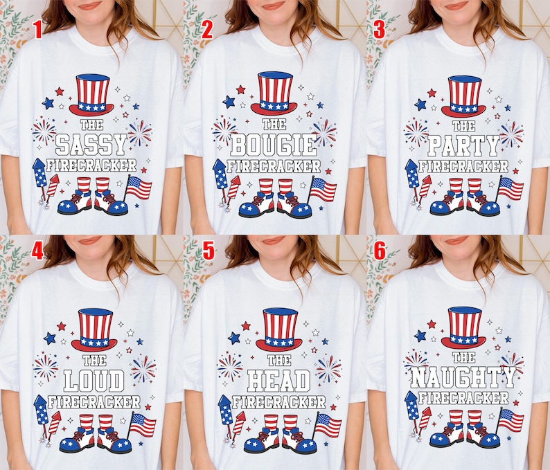 May include: White t-shirts with patriotic designs. Each shirt features a red, white, and blue top hat, fireworks, stars, and the text "The Sassy Firecracker", "The Bougie Firecracker", "The Party Firecracker", "The Loud Firecracker", "The Head Firecracker", and "The Naughty Firecracker".