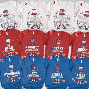 May include: A collection of twelve short-sleeved t-shirts in white, red, and blue. Each shirt features a patriotic design with an Uncle Sam hat, fireworks, and the text "The Sassy Firecracker", "The Bougie Firecracker", and other fun phrases.