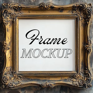May include: A gold ornate picture frame with the words "Frame MOCKUP" in black script and block letters. The frame has intricate details and is set against a textured, dark gray and blue background. A small "PSD" logo is in the bottom left corner.