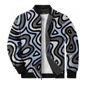 May include: A zip-up bomber jacket featuring a unique abstract pattern in light blue, gray, black, and white. The jacket has a black collar, cuffs, and hem, with a full-length zipper. A white t-shirt is visible underneath.