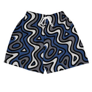 May include: Blue, gray, and white patterned shorts with a drawstring waist. The shorts feature a repeating wavy design with triangular accents. The shorts are made of a lightweight material.
