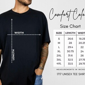May include: Black unisex tee shirt with a size chart. The size chart shows measurements in inches for sizes S to 4XL. The shirt has the text "Comfort Colors" and "1717 Unisex Tee Shirt".