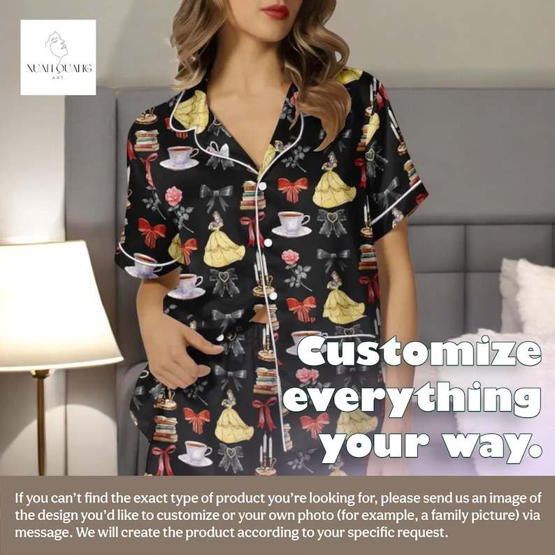 A woman wearing a black pajama top with a printed design of various characters, including Belle from Beauty and the Beast.