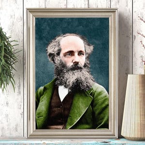 May include: Framed portrait of a man with a long beard, wearing a green jacket and white shirt. The portrait is in a silver frame, displayed on a distressed blue shelf. A vase and a black and white polka dot cup are on the shelf.