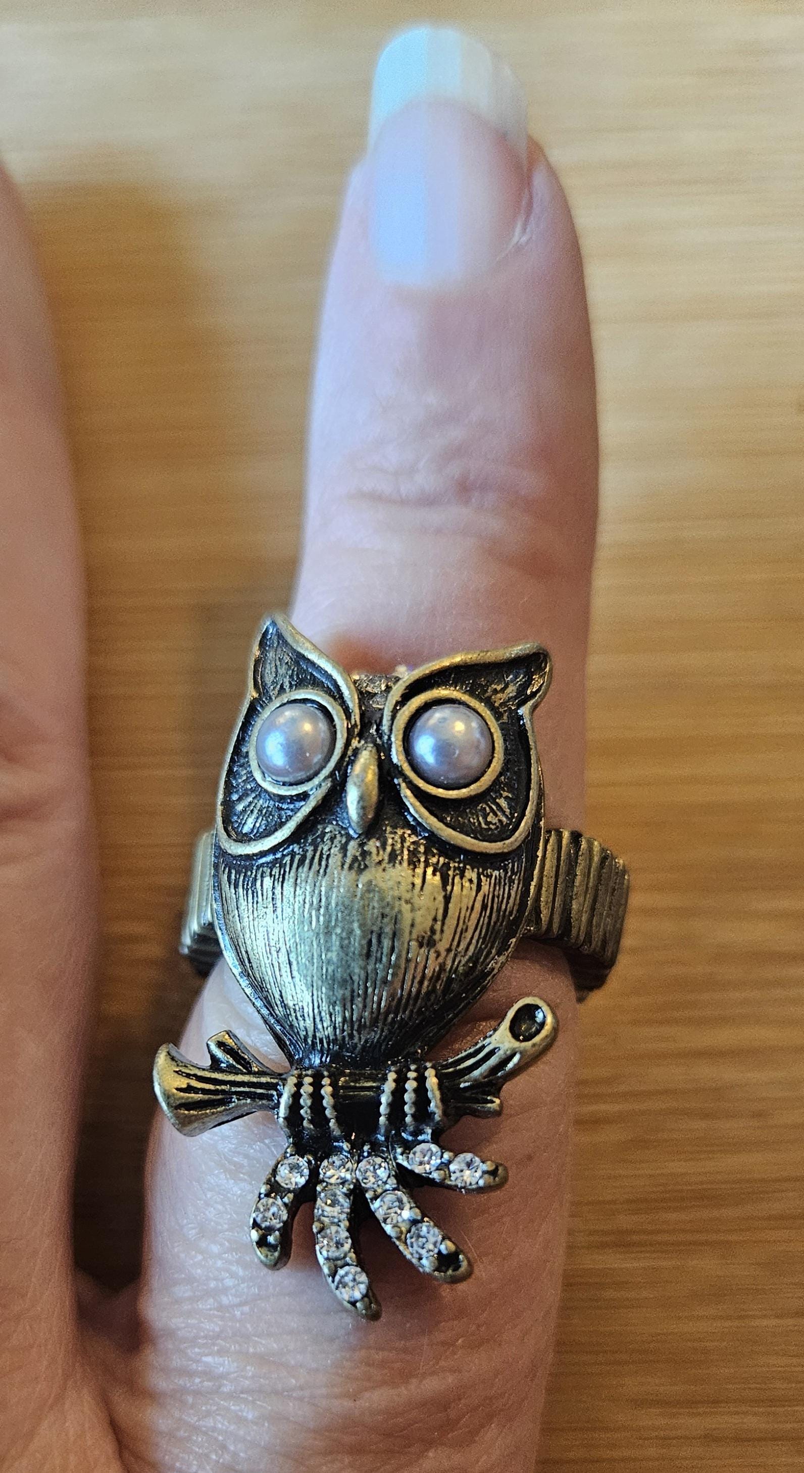 Vintage stretch ring of an owl with pearl eyes Mark by Avon in original box.