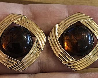 Trifari goldtoned earrings with large round brown cabachons!
