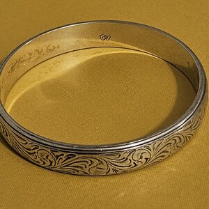 May include: A rustic wooden sign with the text "Welcome to our home" in white lettering. The sign features a distressed finish and a simple, inviting design, perfect for a front porch or entryway.