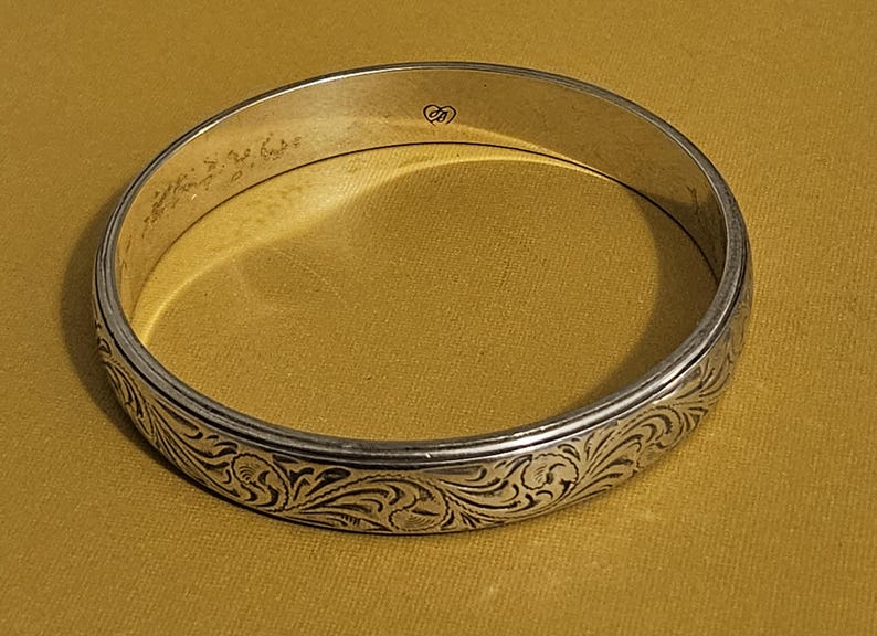 May include: A rustic wooden sign with the text "Welcome to our home" in white lettering. The sign features a distressed finish and a simple, inviting design, perfect for a front porch or entryway.