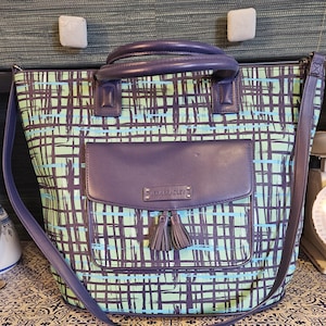 Vera Bradley tassel bag in blues and purples in barely used condition. Free Shipping in US. 16*14.
