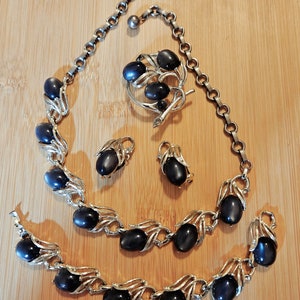 Marvelous vintage lucite moonglow set with earrings, necklace , bracelet, and brooch by LISNER in excellent vintage