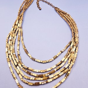 Beautiful goldtoned multi strand necklace by Chico&#39;s in very good Vintage condition.