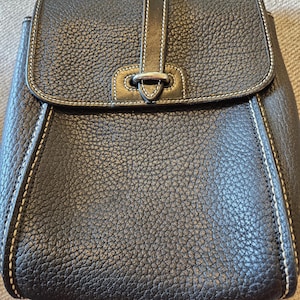 Dooney & Bourke vintage black pebbled all weather leather backpack purse in excellent vintage condition! 10*7. Free Shipping in US.