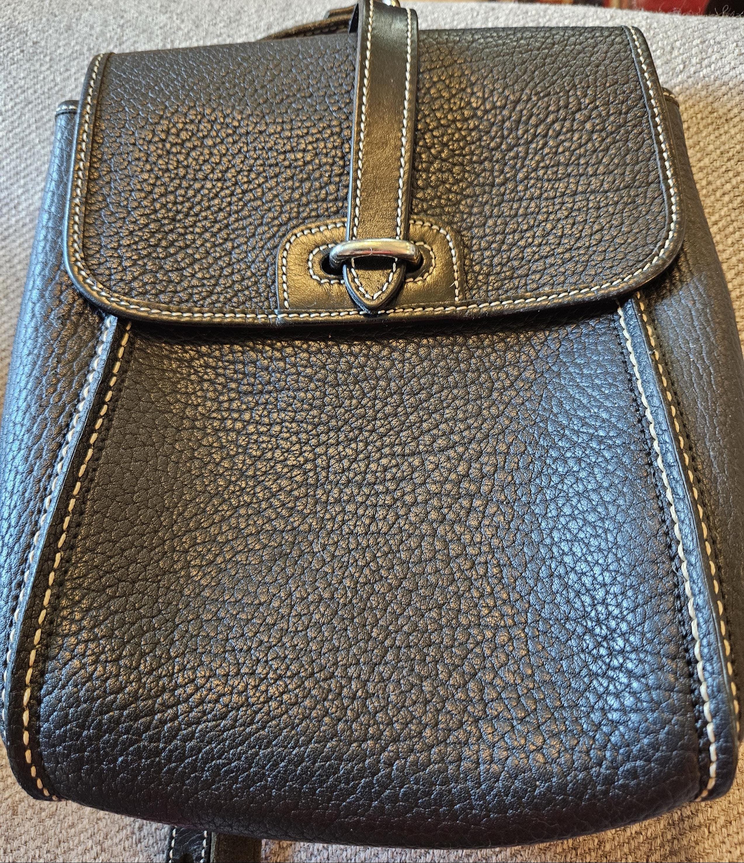 Dooney & Bourke vintage black pebbled all weather leather backpack purse in excellent vintage condition! 10*7. Free Shipping in US.
