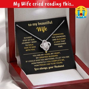 May include: A silver necklace with a knot pendant, presented in a wooden gift box. The card inside reads "to my beautiful Wife" with a heartfelt message from "your Husband". The text at the top says "My Wife cried reading this.."