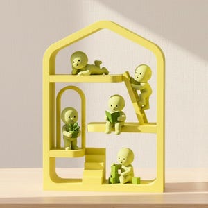 May include: A yellow, house-shaped shelf unit with five small, green figures in various poses. One figure is lying down, another is climbing a ladder, one is reading a book, one is holding a plant, and the last is building with blocks.