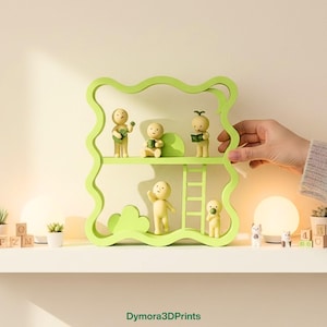 May include: A light green, wavy-edged shelf unit with two levels, holding small, yellow figurines. The figurines are in various poses, some holding objects. A hand is holding the shelf. The shelf is on a white surface.