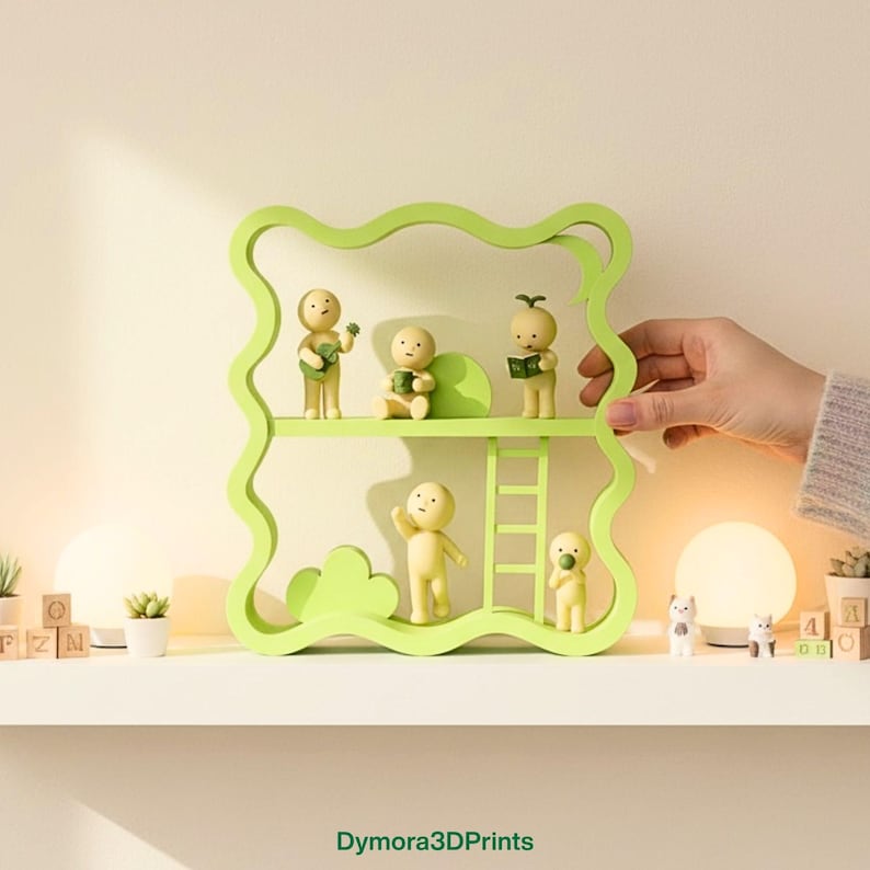 May include: A light green, wavy-edged shelf unit with two levels, holding small, yellow figurines. The figurines are in various poses, some holding objects. A hand is holding the shelf. The shelf is on a white surface.