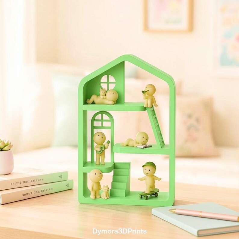 May include: A light green, house-shaped shelf unit with multiple levels, each featuring small, yellow figurines in various poses. Some figurines are lounging, playing instruments, or skateboarding. The unit is on a wooden surface with books and a notebook.