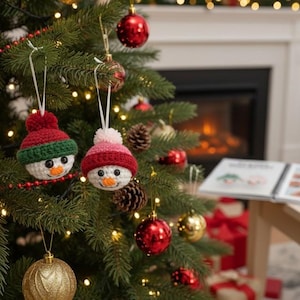 May include: A decorated Christmas tree with ornaments, including red and gold baubles, pine cones, and crocheted snowman decorations. The snowman ornaments have red and green hats. A fireplace and a book are in the background.