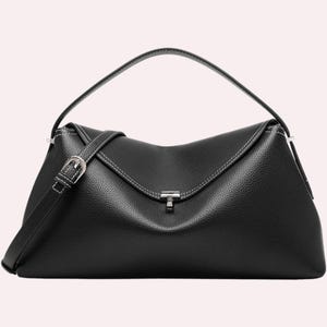 May include: A black leather handbag with a top handle and a detachable shoulder strap. The bag features a silver-tone buckle and a clasp closure. White stitching accents the edges of the bag.