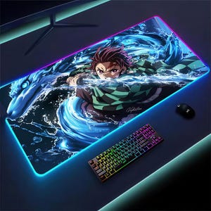 May include: A white ceramic mug with a black handle and the text "But First, Coffee" in a bold, black font. The mug is set against a blurred background, suggesting a cosy setting.