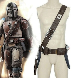 May include: A brown leather bandolier and utility belt set featuring silver-colored cylindrical cartridges, a rectangular metal buckle, and attached pouches. The gear is displayed on a mannequin torso alongside a figure wearing matching armor.