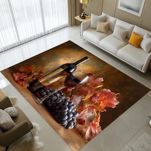 Op de afbeelding: Een decoratief vloerkleed met een stilleven van een wijnfles, een glas rode wijn en een tros druiven. De scène wordt gecompleteerd door herfstbladeren in rood- en oranje tinten, wat een warme, uitnodigende sfeer creëert.