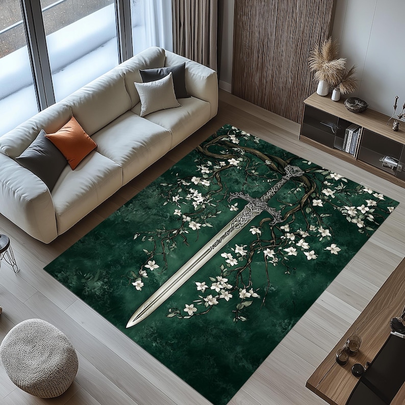 May include: A rectangular area rug with a dark green background featuring a stylized sword design intertwined with flowering branches. The sword is silver, and the flowers are white. The rug is placed in a living room setting.