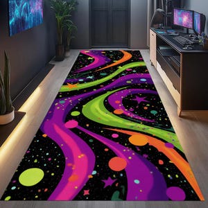 May include: A rectangular area rug with a black background and a vibrant, colorful design. The rug features swirling lines in shades of purple, green, and orange, with scattered stars and circles. The rug is designed for a hallway or entryway.