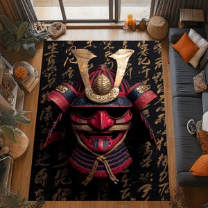 May include: A black area rug featuring a detailed illustration of a samurai helmet. The helmet is red, black, and gold, with intricate detailing. The background is black with gold Japanese calligraphy.