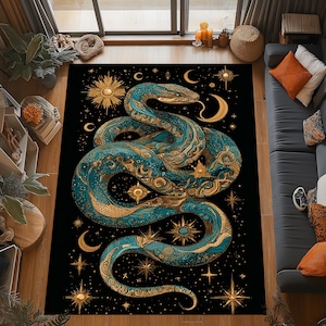 May include: A large, rectangular rug with a teal and gold snake design on a black background. The snake is intricately detailed with celestial elements like stars, moons, and suns. The rug is designed for indoor use.