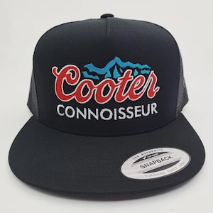 May include: Black trucker hat with a flat brim and mesh back. The front features the embroidered text "Cooter Connoisseur" in red and white, with a blue mountain graphic above the word "Cooter". A white tag with black text is on the brim.