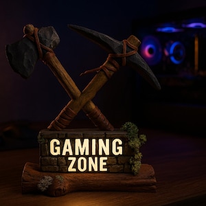 Puede incluir: Un letrero decorativo de "Gaming Zone" con un hacha y un pico cruzados. El letrero está iluminado y muestra el texto "GAMING ZONE". La base es de madera y piedra, con un aspecto rústico.