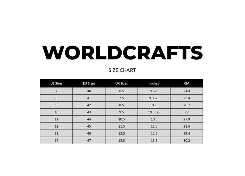 May include: A size chart from Worldcrafts, with US, EU, and UK sizes, inches, and centimeters. The chart includes sizes 7-14, with corresponding EU sizes 40-47. Inches range from 9.625 to 13.5, and centimeters from 24.4 to 30.2.