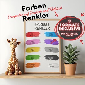 May include: A framed colour chart poster with German and Turkish colour names, featuring colour swatches and the text "Farben Renkler." A stuffed giraffe and potted plant are on a shelf. The poster includes the text "3 Formate Inklusive."
