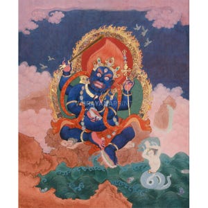 May include: A vibrant painting depicts a blue deity with multiple arms, seated amidst clouds and water. The figure has a fierce expression, adorned with a crown and holding various objects. The artwork features text that reads "VAJRAYANAPRINT" and is set against a backdrop of pink, blue, and gold.