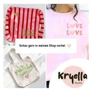May include: A pink and red striped pouch with the name Luisa in gold glitter, a light pink sweatshirt with the text LOVE LOVE and heart icons, and a beige tote bag with the green text Matcha lover and a pink heart, plus the text Kryella Studio.