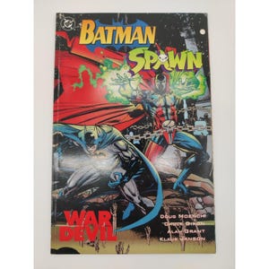 May include: A Batman Spawn War Devil comic book featuring a cover illustration of Batman and Spawn with green energy effects, chains, and red capes. The title text reads Batman Spawn War Devil, with credits for Doug Moench, Chuck Dixon, Alan Grant, and Klaus Janson.