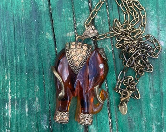 Elephant Pendant 17 1/2" Necklace Honey Color Rhinestone Brasstone Accents Hard Plastic Elephant Long Linked Chain Lobster Clasp Kitschy Fun