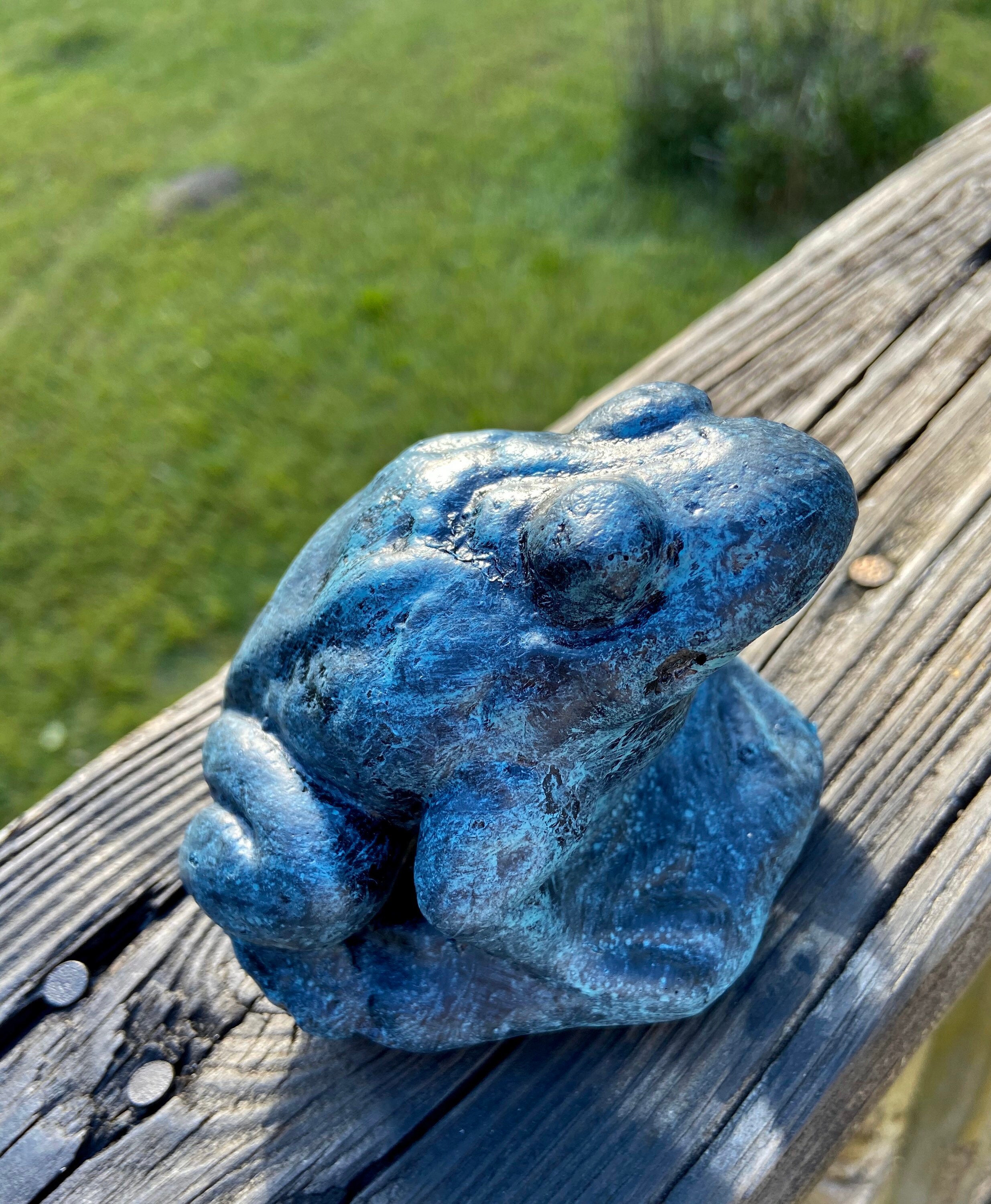 concrete frog statue