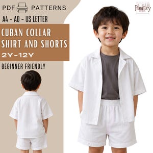 May include: A digital sewing pattern for a Cuban collar shirt and shorts set, sized 2Y-12Y. The design features a white short-sleeved button-down shirt with a collar and matching white shorts with an elastic waistband, shown on a child.